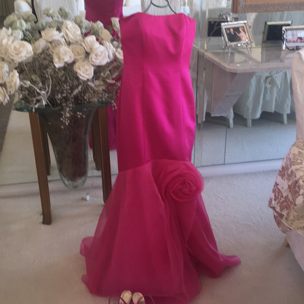 Magenta mermaid gown perfect for prom or wedding.
